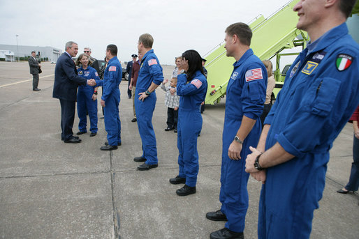 President George W. Bush greets the Space Shuttle Discovery astronauts outside Air Force One, Thursday, Nov. 8, 2007, on the tarmac at Ellington Field in Houston, Texas. President Bush congratulated Space Shuttle Commander Pamela Melroy, left, and fellow astronauts, from left, Pilot George Zamka and mission specialists Scott Parazynski, Stephanie Wilson, Douglas Wheelock, Paolo Nespoli and Clayton Anderson, not seen in photo, on their successful 15-day mission to the International Space Station. White House photo by Eric Draper