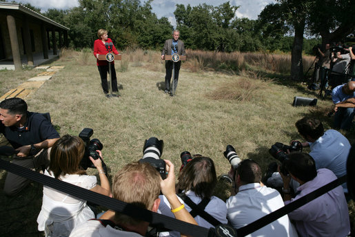 President George W. Bush and German Chancellor Angela Merkel stand before the press following their meeting at the Bush Ranch in Crawford, Texas, Saturday, Nov. 10, 2007. White House photo by Eric Draper