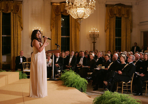 President George W. Bush, Mrs. Laura Bush and guests listen to singer Melinda Doolittle perform Tuesday evening, Nov. 13, 2007 in the East Room of the White House, during a social dinner in honor of America's Promise-The Alliance for Youth. White House photo by Joyce N. Boghosian