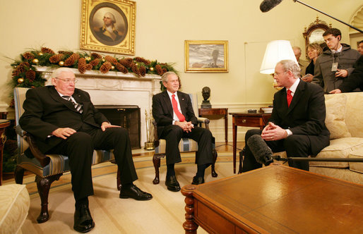 President George W. Bush shares a moment with Ian Paisley, left, First Minister of Northern Ireland, and Martin McGuinness, Deputy First Minister of Northern Ireland, during their visit Friday, Dec. 7, 2007, to the Oval Office. White House photo by Chris Greenberg