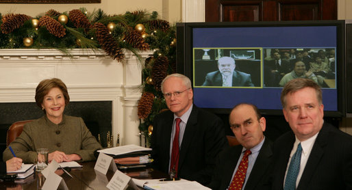 Mrs. Laura Bush is joined by Jim Jeffrey, Assistant to the President and Deputy National Security Advisor; Elliot Abrams, Deputy National Security Advisor for Global Democracy Strategy, and Dennis Wilder, Special Assistant to the President and Senior Director for East Asian Affairs, as she participates in a video conference on Burma in recognition of International Human Rights Day Monday, Dec. 10, 2007, in the Roosevelt Room of the White House. Speaking via video are U.S. Ambassador to Thailand Skip Boyce and Dr. Cynthia Maung, Founder and Director of the Mae Tao Clinic in Mae Sot,Thailand. White House photo by Chris Greenberg