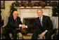 President George W. Bush and President Giorgio Napolitano exchange handshakes during the Italian leader's visit Tuesday, Dec. 11, 2007, to the White House. President Bush told his counterpart, "It's my honor to welcome you. Bilateral relations with the United States and Italy are very good. We have a lot of interchange between our countries, with business as well as travel." White House photo by Eric Draper