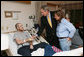 President George W. Bush visits U.S. Navy Hospital Corpsman Christopher Braley and his mother, Debra Braley, of Manteca, Calif., at the National Naval Medical Center in Bethesda, Md., Wednesday, Dec. 19, 2007. Braley is recovering from injuries sustained in Operation Iraqi Freedom. White House photo by Joyce N. Boghosian