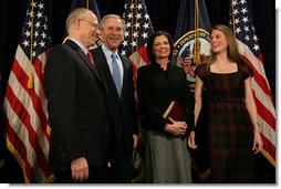 President George W. Bush smiles as he stands with Secretary of Veteran Affairs Lt. Gen. James Peake (Ret.), his wife, Janice, and daughter, Kimberly, after the former Army Surgeon General was sworn in during the ceremonial event Thursday, Dec. 20, 2007, at the U.S. Department of Veterans Affairs. White House photo by Chris Greenberg