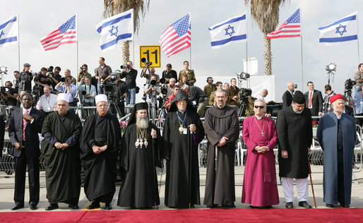 Clergymen wait alongside the red carpet Wednesday, Jan. 9, 2008, in anticipation for the arrival of Air Force One and President George W. Bush to Ben Gurion International Airport in Tel Aviv. The arrival of the President marked the first day of his eight-day Mideast trip. White House photo by Chris Greenberg