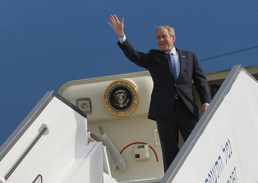 President George W. Bush stands at the top of the stairs to Air Force One Wednesday morning, Jan. 9, 2008, after arriving at Ben Gurion International Airport for the start of his Mideast visit. White House photo by Eric Draper