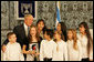 President George W. Bush poses with singers Wednesday, Jan. 9, 2008, at the President’s Residence in Jerusalem, where he met with his Israeli counterpart Shimon Peres. White House photo by Chris Greenberg