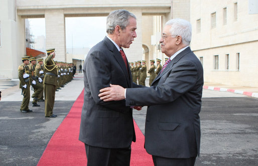President George W. Bush and President Mahmoud Abbas of the Palestinian Authority embrace at the end of the red carpet as they end their meeting Thursday, Jan. 10, 2008, in Ramallah. Said the President, “É Is it possible for the Israelis and the Palestinians to work out their differences on core issues so that a vision can emerge? And my answer is, absolutely.” White House photo by Eric Draper