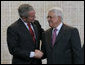 President George W. Bush and President Mahmoud Abbas exchange handshakes Thursday, Jan. 10, 2008, after a joint press availability at Muqata, the headquarters of the Palestinian Authority, in Ramallah. White House photo by Chris Greenberg