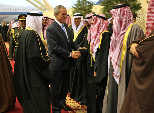 President George W. Bush is greeted by a Kuwaiti welcoming delegation Friday, Jan. 11, 2008, during the arrival ceremonies at Kuwait International Airport in Kuwait City, the second stop on the President's eight-day, Mideast visit. White House photo by Eric Draper