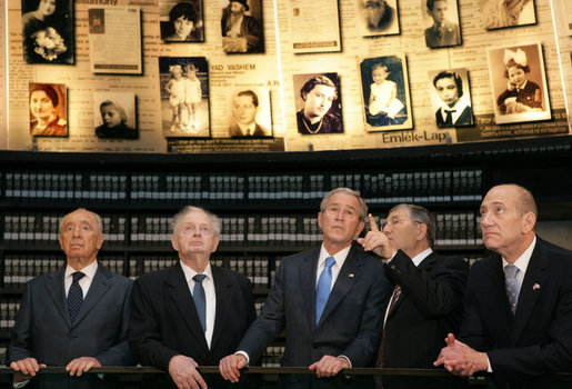 President George W. Bush listens to Avner Shalev, Chairman of the Yad Vashem Directorate, as he visits the Hall of Names in Yad Vashem, the Holocaust Museum, in Jerusalem Friday, Jan. 11, 2008. Joining the President in the visit are, from left, President Shimon Peres, of Israel; Josef Lapid, Chairman of the Yad Vashem Council, and Israel's Prime Minister Ehud Olmert. White House photo by Chris Greenberg