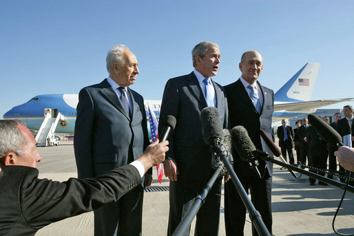 President George W. Bush speaks to the media Friday, Jan. 11, 2008, as he stands with President Shimon Peres of Israel, right, and Prime Minister Ehud Olmert at Tel Aviv’s Ben Gurion International Airport. The President concluded his two-day visit to Israel with a visit to Yad Vashem, the Holocaust Museum in Jerusalem, and the ruins of Capernaum on the Sea of Galilee. White House photo by Chris Greenberg