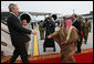 President George W. Bush reaches out to King Hamad Bin Isa Al-Khalifa as he deplanes Air Force One Saturday, Jan. 12, 2008, after arriving at Bahrain International Airport in Manama, Bahrain. White House photo by Eric Draper