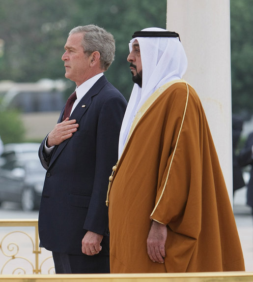 President George W. Bush and President Sheikh Khalifa bin Zayed Al Nahyan of the United Arab Emirates, stand for their national anthems Sunday, Jan. 13, 2008, during arrival ceremonies for President Bush at Al Mushref Palace in Abu Dhabi. White House photo by Eric Draper