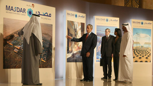 President George W. Bush points to a display in the Masdar Exhibition Monday, Jan. 14, 2008, at the Emirates Palace Hotel. Created in 2006, Masdar is a global cooperative platform for open engagement in the search for solutions to some of mankind's most pressing issues, such as energy security, climate change and truly sustainable human development. White House photo by Eric Draper