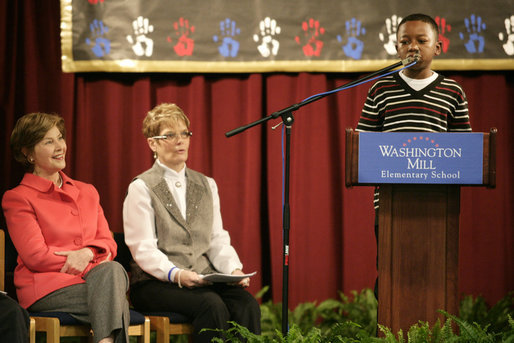 Mrs. Laura Bush and Dr. Tish Howard, Principal, Washington Mill Elementary School, listen as Damien Floyd, Student, reads an essay he wrote on George Washington, during a Mount Vernon's "George Washington's Return to School" ceremony at Washington Mill Elementary School Tuesday, January 15, 2008, in Alexandria, Virginia. The “Portrait of Leadership” initiative was planned to coincide with the 275th birthday year of George Washington, celebrated in February of 2007, to help put a portrait of George Washington in class rooms in all fifty states. White House photo by Shealah Craighead