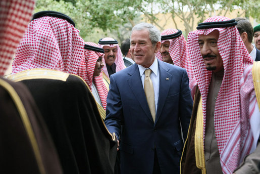 Accompanied by Prince Salman bin Abdul Al-Aziz, right, President George W. Bush greets officials as he arrives Tuesday, Jan. 15, 2008, at Al Murabba Palace in Riyadh. White House photo by Eric Draper