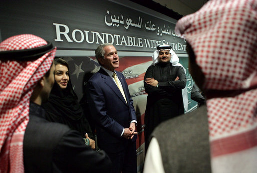 Participants in a roundtable discussion with President George W. Bush talk with him afterwards Tuesday, Jan. 15, 2008, at the U. S. Embassy in Riyadh. The President told the entrepreneurs, “I love the fact that some of you were educated in America. I think you'll find you got a good education there, but more importantly, Americans get to see you, and you get to see them. And the best way to achieve better understanding in the world is for folks just to get together, and get to understand that we share the same God, and we share the same aspirations for children and for our futures.” White House photo by Chris Greenberg