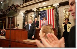 President George W. Bush acknowledges the applause Monday, Jan. 28, 2008, as he arrives at the podium on the House floor at the U.S. Capitol to deliver his final State of the Union address. White House photo by Eric Draper