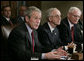 President George W. Bush, joined by Deputy Secretary of Defense Gordon England, center, and Deputy National Security Advisor James Jeffrey, right, talks to reporters Tuesday, Jan. 29, 2008, during a meeting in the Cabinet Room of the White House with the Joint Chiefs and Combatant Commanders. White House photo by Eric Draper