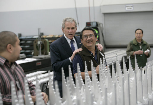 President George W. Bush speaks with assembly workers on his tour of the Robinson Helicopter Company Wednesday, Jan. 30, 2008 in Torrance, Calif. White House photo by Eric Draper