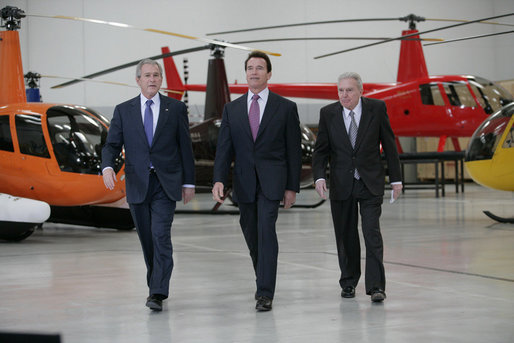 President George W. Bush tours the Robinson Helicopter Company Wednesday, Jan. 30, 2008 in Torrance, Calif., joined by California Governor Arnold Schwarzenegger and CEO Frank Robinson. Following the tour President Bush addressed employees and members of the media on the nation’s economy and the importance of free trade agreements. White House photo by Eric Draper
