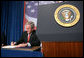 President George W. Bush signs a 15-day extension to the Protect America Act Thursday, Jan. 31, 2008, during his visit to Las Vegas. "This Protect America Act and its strengthening is essential to the security of the United States of America. I expect members from both political parties to get this work done so our professionals can protect the American people," said the President. "This will give people and Congress time to pass a good piece of legislation that makes sure that our professionals have the tools necessary to do their job, and provides liability protection to carriers who it is assumed helped us in protecting the American people." White House photo by Eric Draper