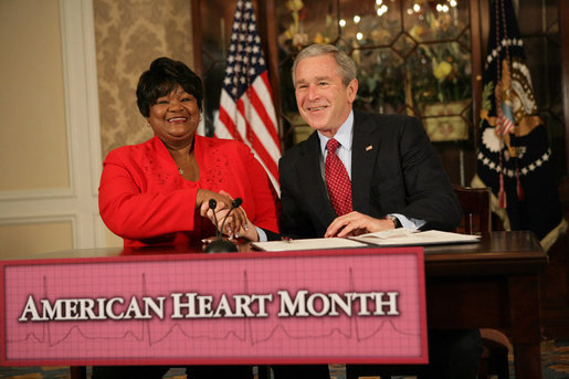 President George W. Bush shakes the hand of Joyce Cullen, a heart disease survivor, after signing the Presidential Proclamation in Honor of American Heart Month Friday, Feb. 1, 2008, in Kansas City, Mo. In signing the proclamation, the President thanked Mrs. Cullen for her work and said, ".She's very much a part of the Heart Truth Campaign here in Kansas City. And she's helping people understand two things -- one, be able to recognize the symptoms, and secondly, be able to prevent the symptoms from happening in the first place. So I want to thank you for being a strong leader in the campaign for awareness." White House photo by Eric Draper