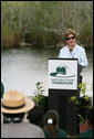 Mrs. Laura Bush addresses students and guests Wednesday, Feb. 6, 2008, during the Junior Ranger "First Bloom" planting event in Everglades National Park, Florida, praising a program to help bring back native trees in areas of the Everglades overgrown with non-native plants. White House photo by Shealah Craighead