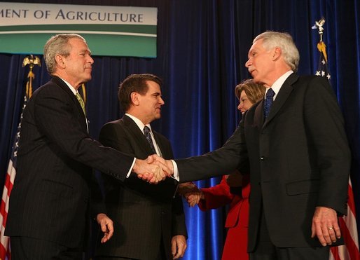 President George W. Bush congratulates Secretary of Agriculture Ed Schafer after he was ceremoniously sworn in Wednesday, Feb. 6, 2008, at the U.S. Department of Agriculture. In the background are Mrs. Nancy Schafer and Deputy Secretary Chuck Conner. White House photo by Chris Greenberg