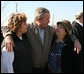 President George W. Bush embraces residents of Lafayette, Tennessee during his visit Friday, Feb. 8, 2008, to the region that was hard hit by Tuesday's tornadoes. White House photo by Chris Greenberg