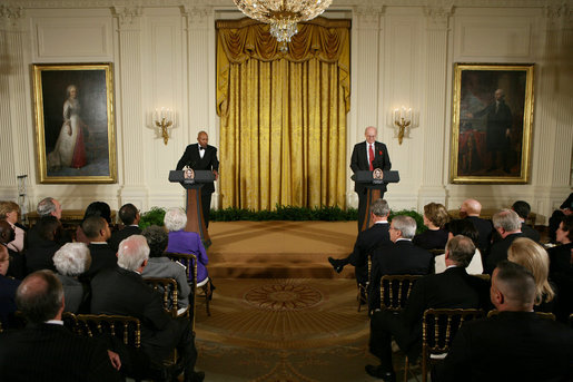 President George W. Bush and First Lady Laura Bush listen as Actor Avery Brooks, (L), and Dr. Allen Guelzo make remarks during a ceremony in the East Room of the White House honoring Abraham Lincoln's 199th Birthday, Sunday, Feb. 10, 2008. White House photo by Chris Greenberg