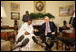 President George W. Bush and Mali President Amadou Touré meet in the Oval Office Tuesday, Feb. 12, 2008, at the White House. Said President Bush upon welcoming his fellow leader, "I was touched by the President's concern about the life of the average citizen in Mali. This is a country that's committed to the rights of its people, and we're proud to be standing side-by-side with you." White House photo by Eric Draper