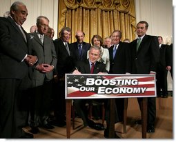 President George W. Bush signs H.R. 5140, the Economic Stimulus Act of 2008, Wednesday, Feb. 13, 2008, in the East Room at the White House. 