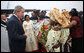 President George W. Bush is greeted by flower girls upon arrival Saturday, Feb. 6, 2008, at Cadjehoun International Airport in Cotonou, Benin, after he and Mrs. Laura Bush arrived at the first stop on their five-country, Africa visit. White House photo by Eric Draper
