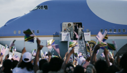A sea of Tanzania and U.S. flags greets Air Force One as the aircraft carrying President George W. Bush and Mrs. Laura Bush arrives at Julius Nyerere International Airport Saturday, Feb. 16, 2008, in Dar es Salaam. White House photo by Shealah Craighead