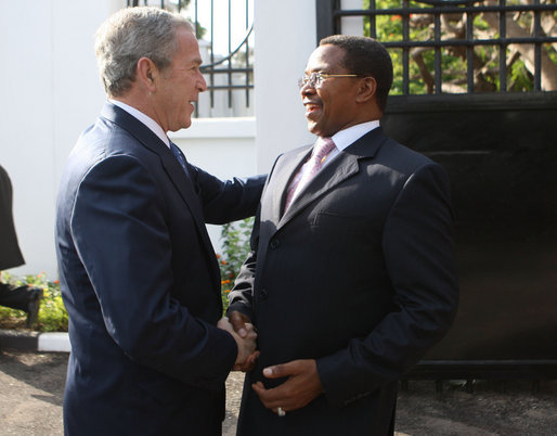 President George W. Bush is greeted by President Jakaya Kikwete of Tanzania, upon his arrival Sunday, Feb. 17, 2008, at the State House in Dar es Salaam. White House photo by Eric Draper