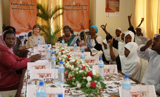 Mrs. Laura Bush and Mrs. Salma Kikwete sit at the head of the table during a roundtable Sunday, Feb. 17, 2008, in Dar es Salaam, with Madrasa graduates who have received HIV prevention education as part of their religious instruction. Madrasa training is comparable to the training students in the U.S. receive in Sunday school or Hebrew school. White House photo by Shealah Craighead