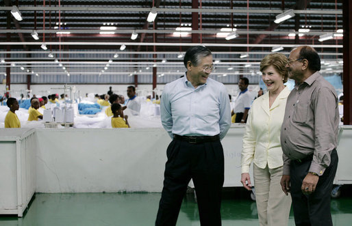 Mrs. Laura Bush speaks with the management representatives of A to Z Textiles Monday, Feb. 18, 2008, in Arusha, Tanzania, where workers stitch mosquito nets in the fight against malaria. White House photo by Shealah Craighead
