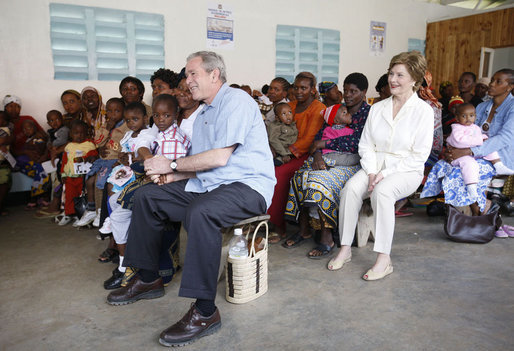 President George W. Bush and Mrs. Laura Bush join children and their families in the pediatric outpatient clinic Monday, Feb. 18, 2008, at the Meru District Hospital in Arusha, Tanzania. White House photo by Eric Draper