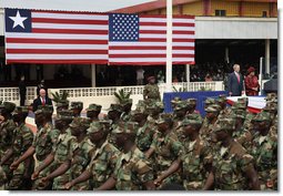 President George W. Bush and Liberian President Ellen Johnson Sirleaf review Liberian troops Thursday, Feb. 21, 2008, during President Bush’s visit to the Barclay Training Center in Monvoria, Liberia. White House photo by Shealah Craighead