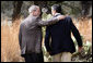 President George W. Bush and Prime Minister Anders Fogh Rasmussen of Denmark walk together at the conclusion of their press availability at The Bush Ranch in Crawford, Texas, Saturday, March 1, 2008, in Crawford, Texas. White House photo by Eric Draper