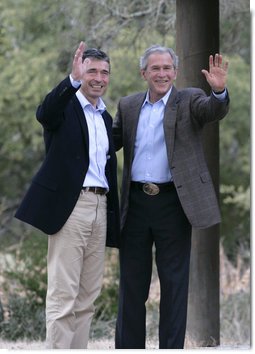 President George W. Bush and Prime Minister Anders Fogh Rasmussen of Denmark wave to the media at the conclusion of their press availability at The Bush Ranch in Crawford, Texas, Saturday, March 1, 2008, in Crawford, Texas. White House photo by Shealah Craighead