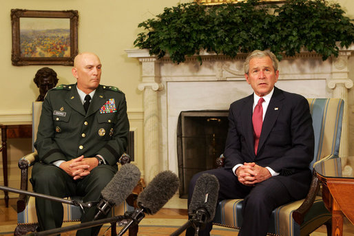 President George W. Bush speaks to reporters during a meeting with former Commanding General of Multi-National Corps-Iraq, Lieutenant General Ray Odierno, Monday March 3, 2008, in the Oval Office. President Bush has nominated General Odierno to Vice Chief of Staff of the Army and thanked him for his 30 months of service in Iraq. White House photo by Joyce N. Boghosian