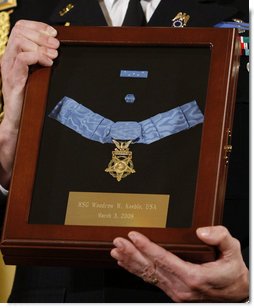 A White House military aide holds the Medal of Honor presented posthumously to U.S. Army Master Sgt. Woodrow Wilson Keeble by President George W. Bush, Monday, March 3, 2008 in the East Room of the White House. Master Sgt. Keeble, the first full-blooded Sioux Indian to receive the Medal of Honor, was recognized for his gallantry above and beyond the call of duty during military action in the Korean War. White House photo by Eric Draper
