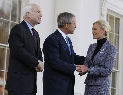 As her husband, Senator John McCain, looks on, President George W. Bush greets Cindy McCain after arriving Wednesday, March 5, 2008, at the White House, where the President offered his endorsement of the Republican presidential nominee. White House photo by Eric Draper