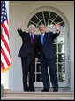 President George W. Bush and Senator John McCain (R-Ariz.) wave after delivering a statement Wednesday, March 5, 2008, in the Rose Garden of the White House. In welcoming Senator McCain and his wife, Cindy, the President said, "A while back I don't think many people would have thought that John McCain would be here as the nominee of the Republican Party -- except he knew he would be here, and so did his wife, Cindy." White House photo by Joyce N. Boghosian