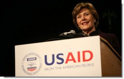 Mrs. Laura Bush delivers remarks Friday, March 7, 2008, during the USAID Celebration of International Women's Day at the Ronald Reagan Building in Washington, D.C. Mrs. Bush told her audience, "We're here today to tell our sisters around the world that we want them to join us. We're here to tell them that the long walk to freedom and equality, even though sometimes it might be a tiresome journey, that it's worth it. And the women of the United States are with them every single step of the way."  White House photo by Joyce N. Boghosian