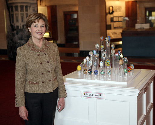 Mrs. Laura Bush poses with the 2008 State Easter Egg Display Monday, March 10, 2008, at the White House Visitors Center in Washington, D.C. The State Egg Display tradition has been going on since 1994, and is coordinated by the American Egg Board who selects an artist from each state to paint/decorate an egg. White House photo by Shealah Craighead