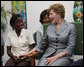 Mrs. Laura Bush speaks with a clinic patient and at risk adolescents during her visit Thursday, March 13, 2008 at the GHESKIO HIV/AIDS Center in Port-au-Prince, Haiti. GHESKIO is a participant in the President’s Emergency Plan for AIDS Relief (PEPFAR), which has contributed approximately $365 million to fight HIV/AIDS in Haiti. White House photo by Shealah Craighead